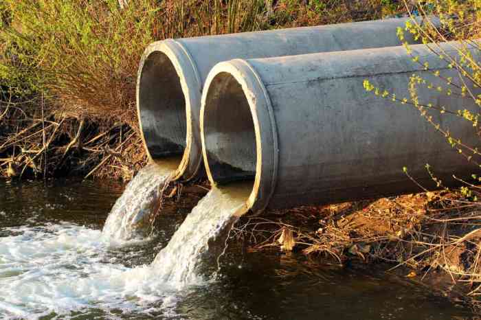 A pipe discharges stormwater into a creek